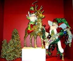 Christmas centerpiece depicting Santa and a reindeer for a Wedding Table Arrangement