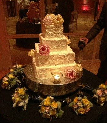 Cake with beautiful fall colored flowers.